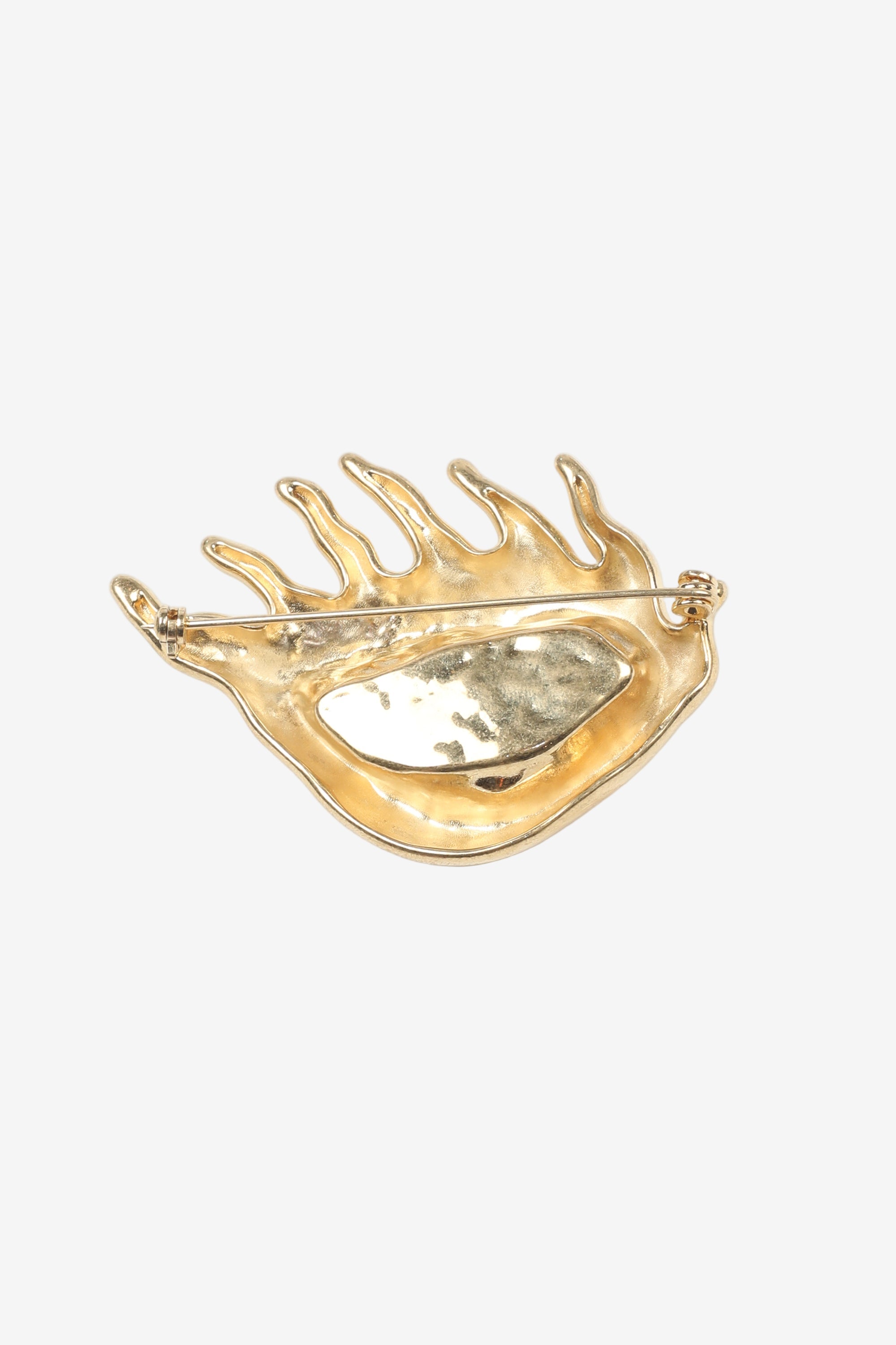 Golden eye-shaped brooch