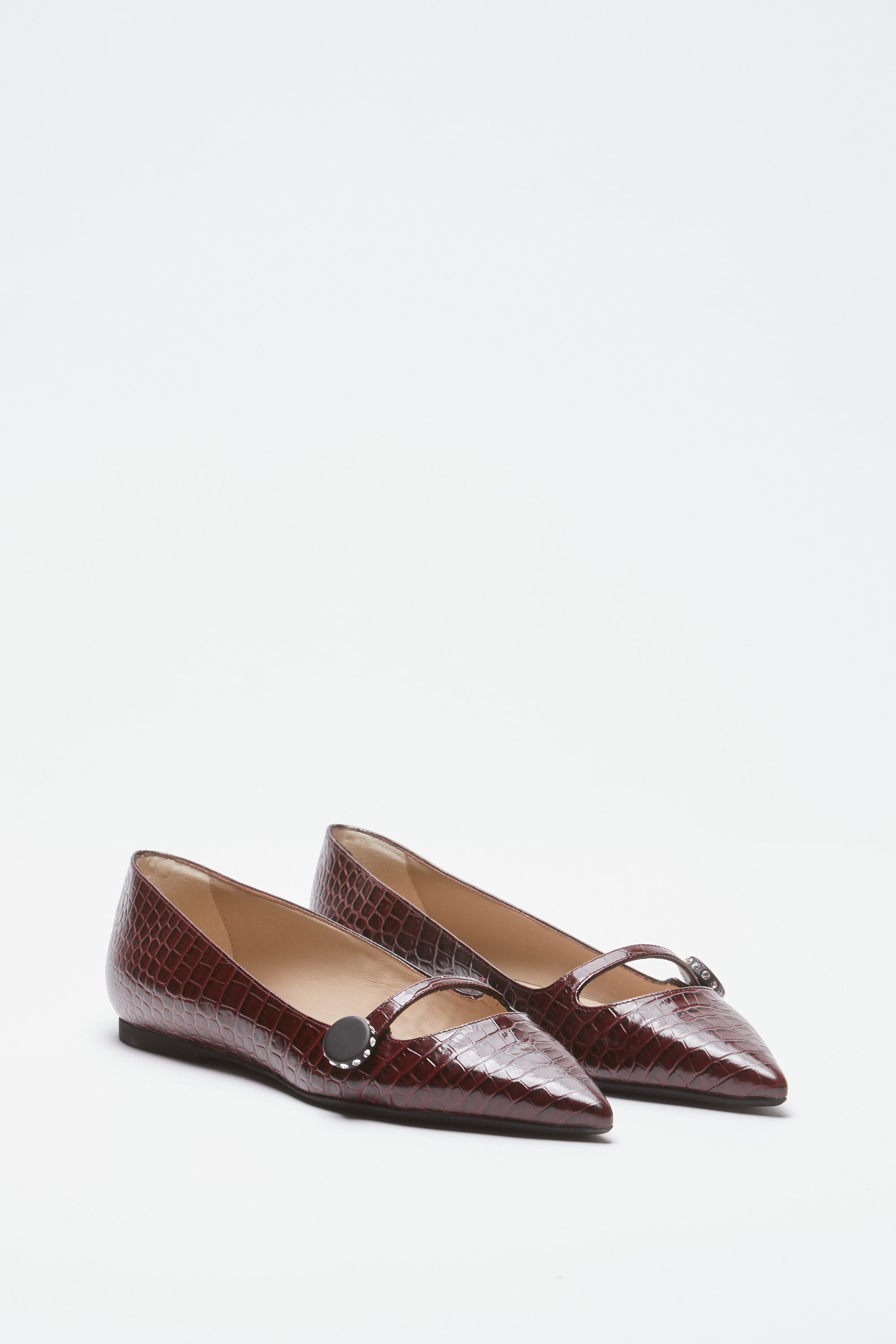 Pointed-toe ballerinas in crocodile print