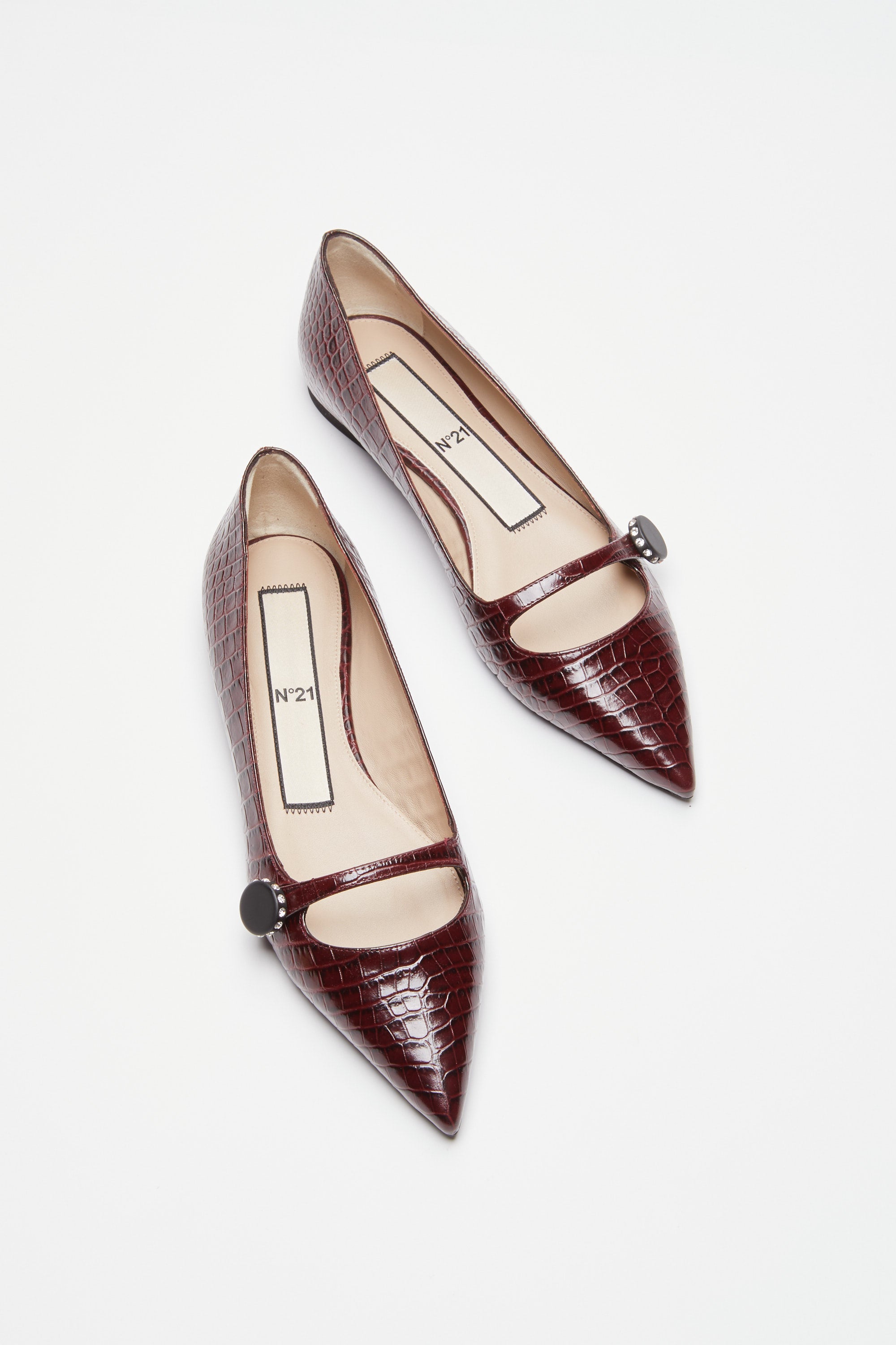 Pointed-toe ballerinas in crocodile print