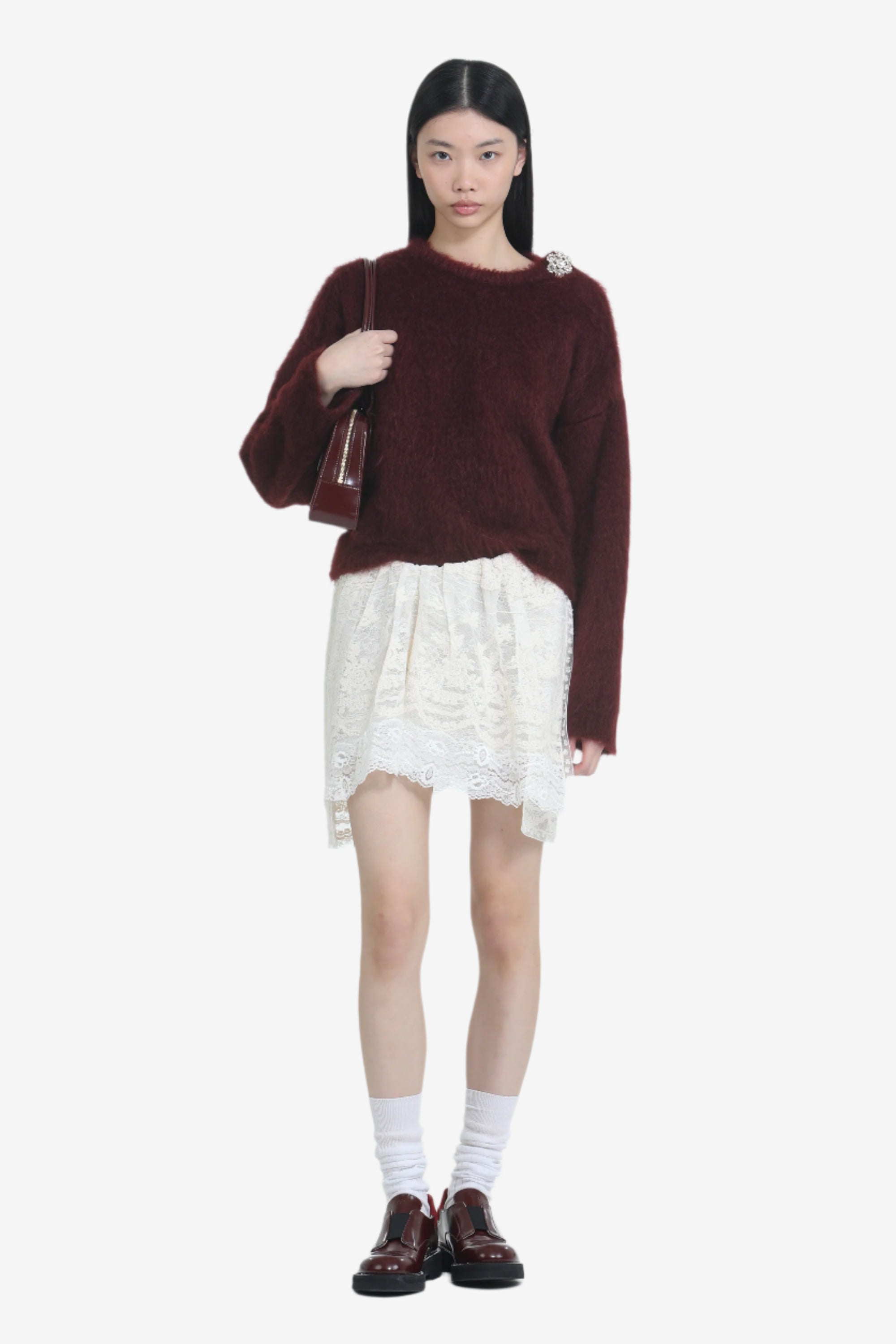 Maglione con bottone gioiello a fiore