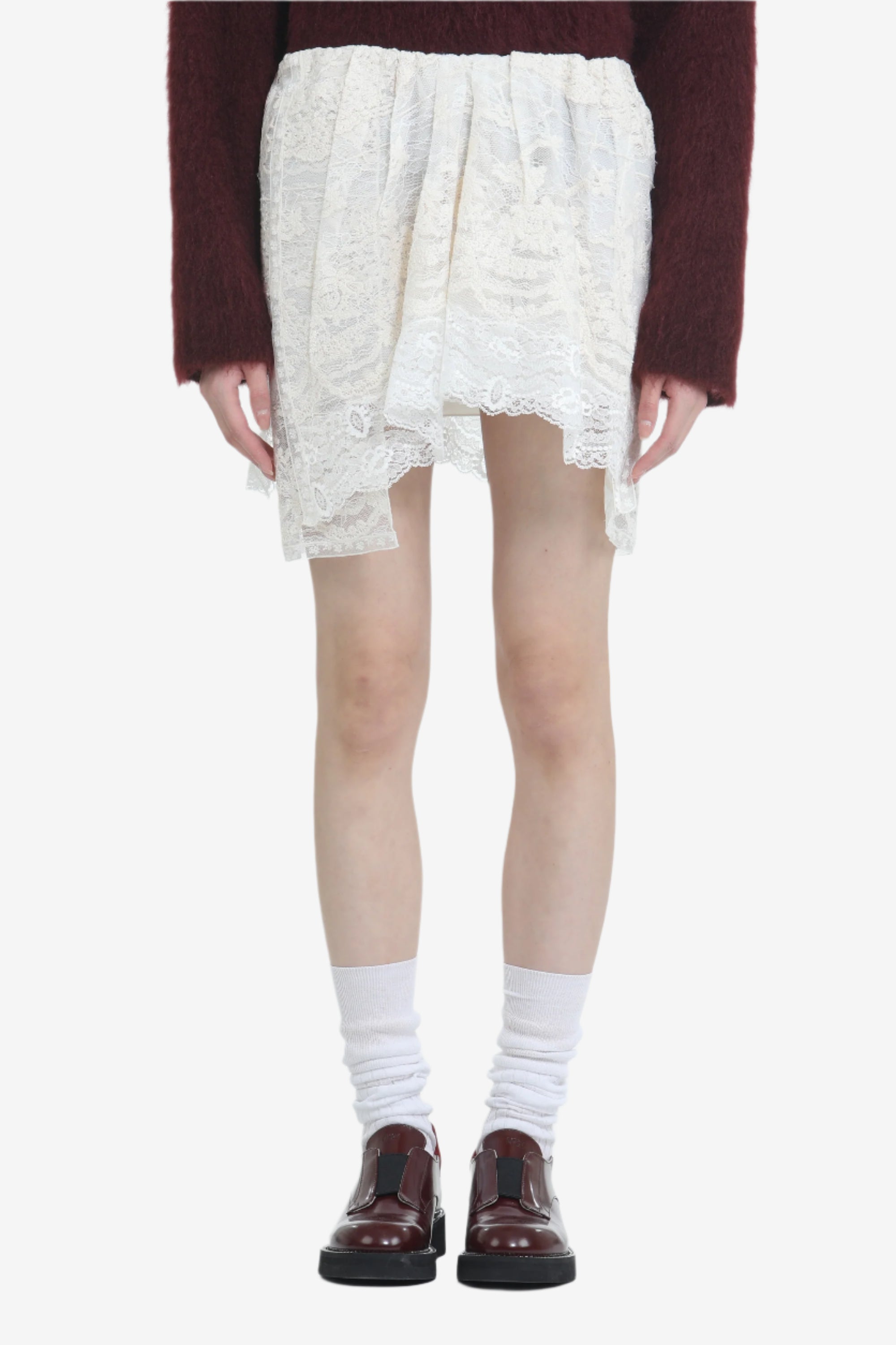 Lace miniskirt with irregular hem