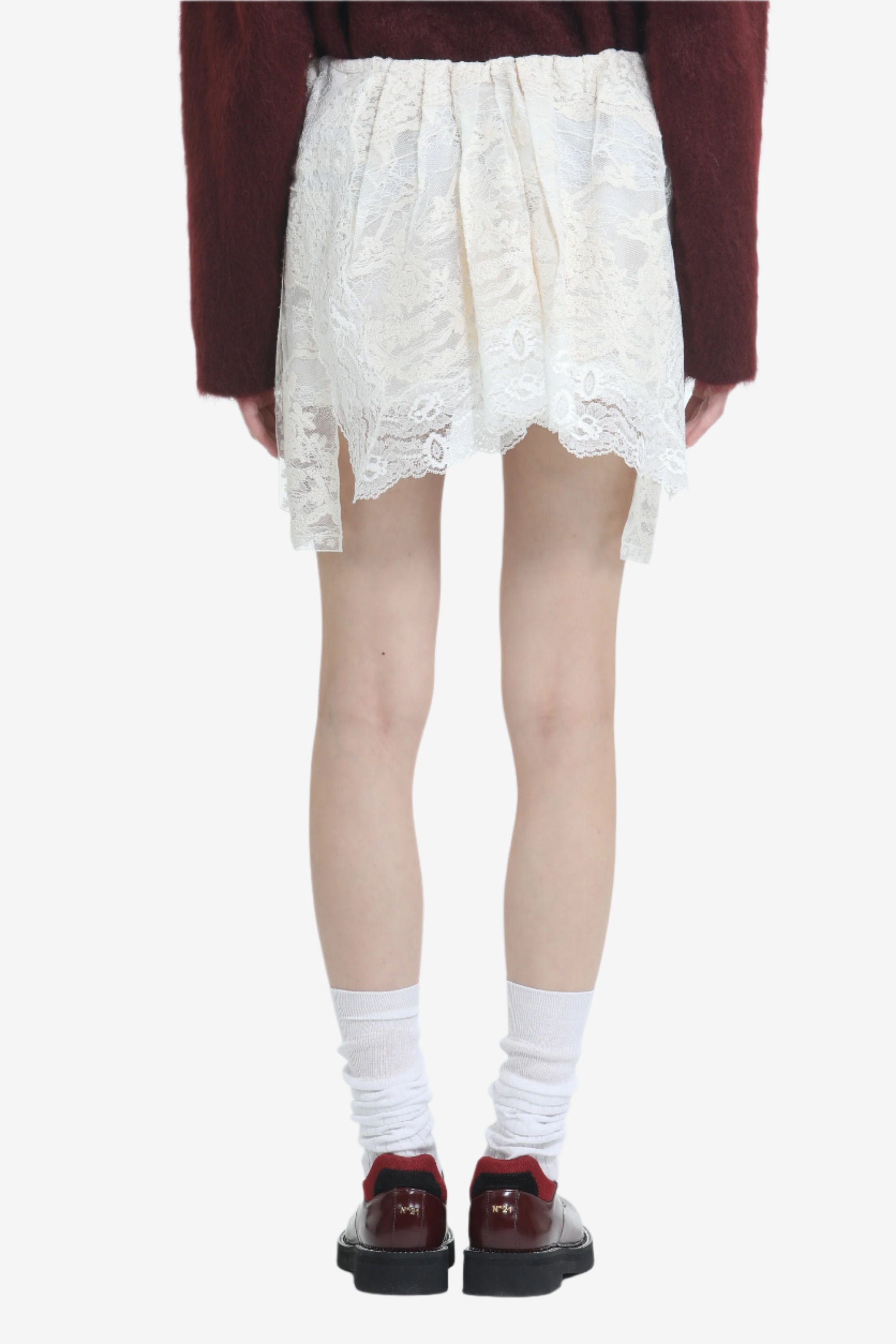 Lace miniskirt with irregular hem