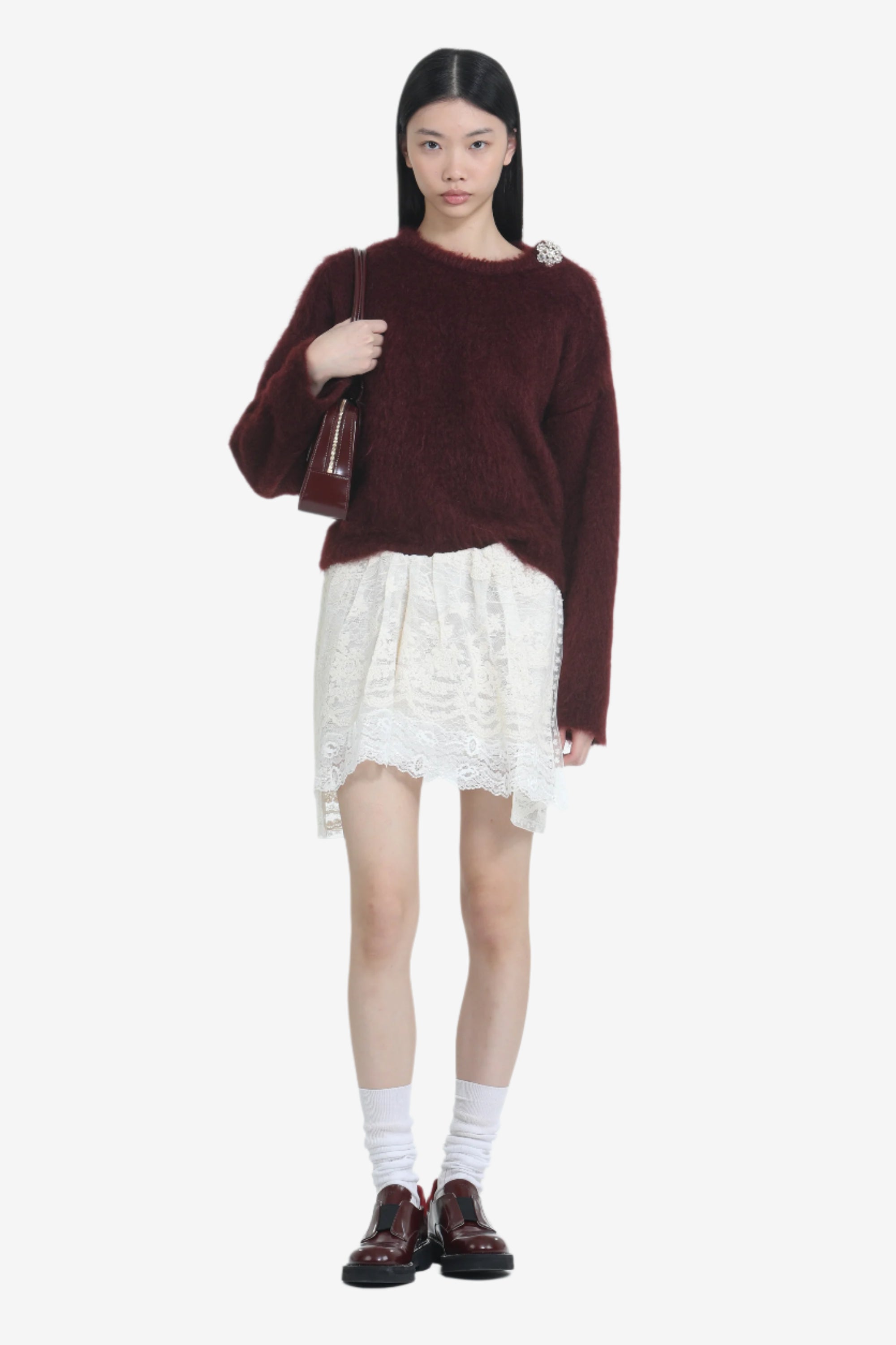 Lace miniskirt with irregular hem