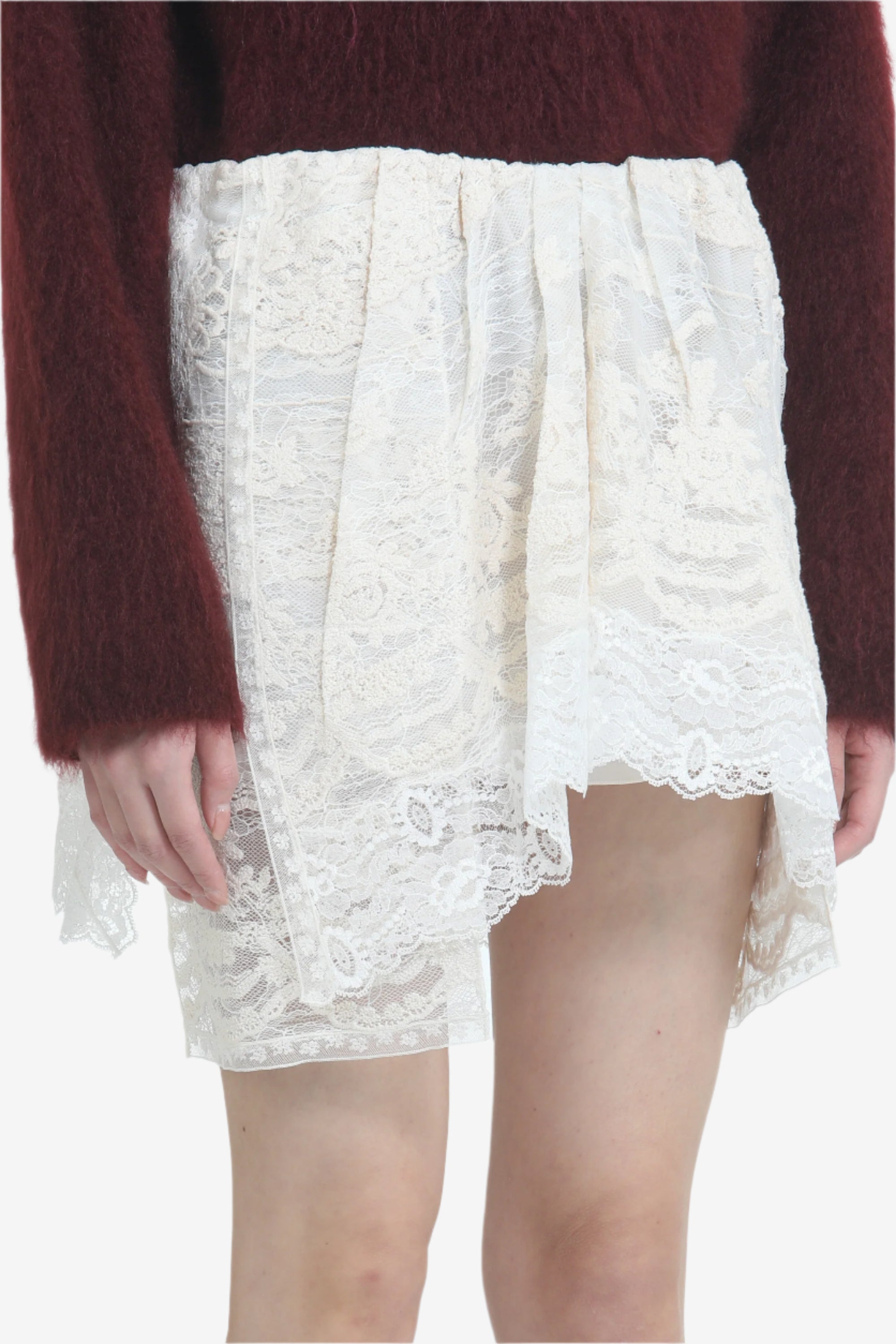 Lace miniskirt with irregular hem