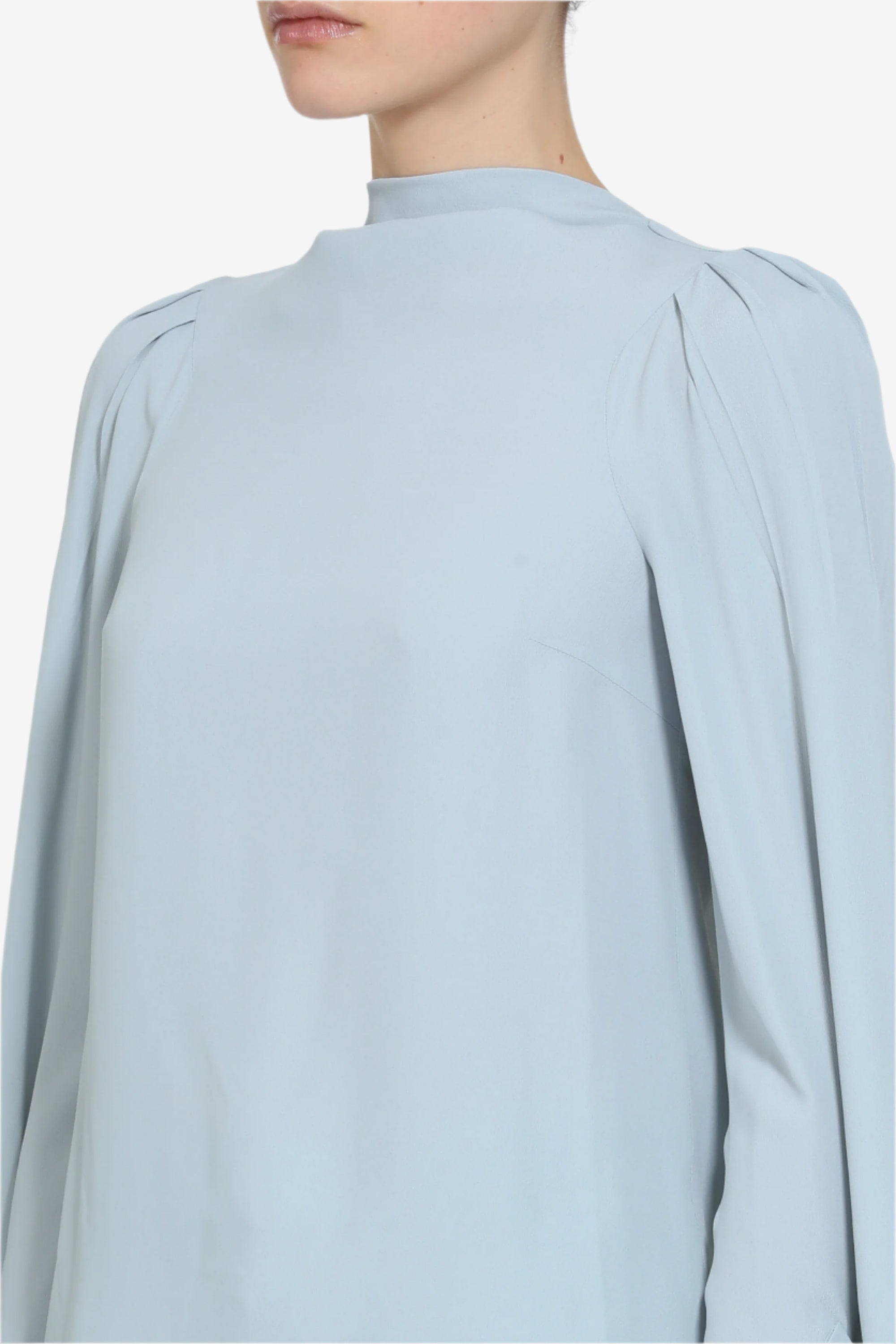Blusa con maniche lunghe svasate