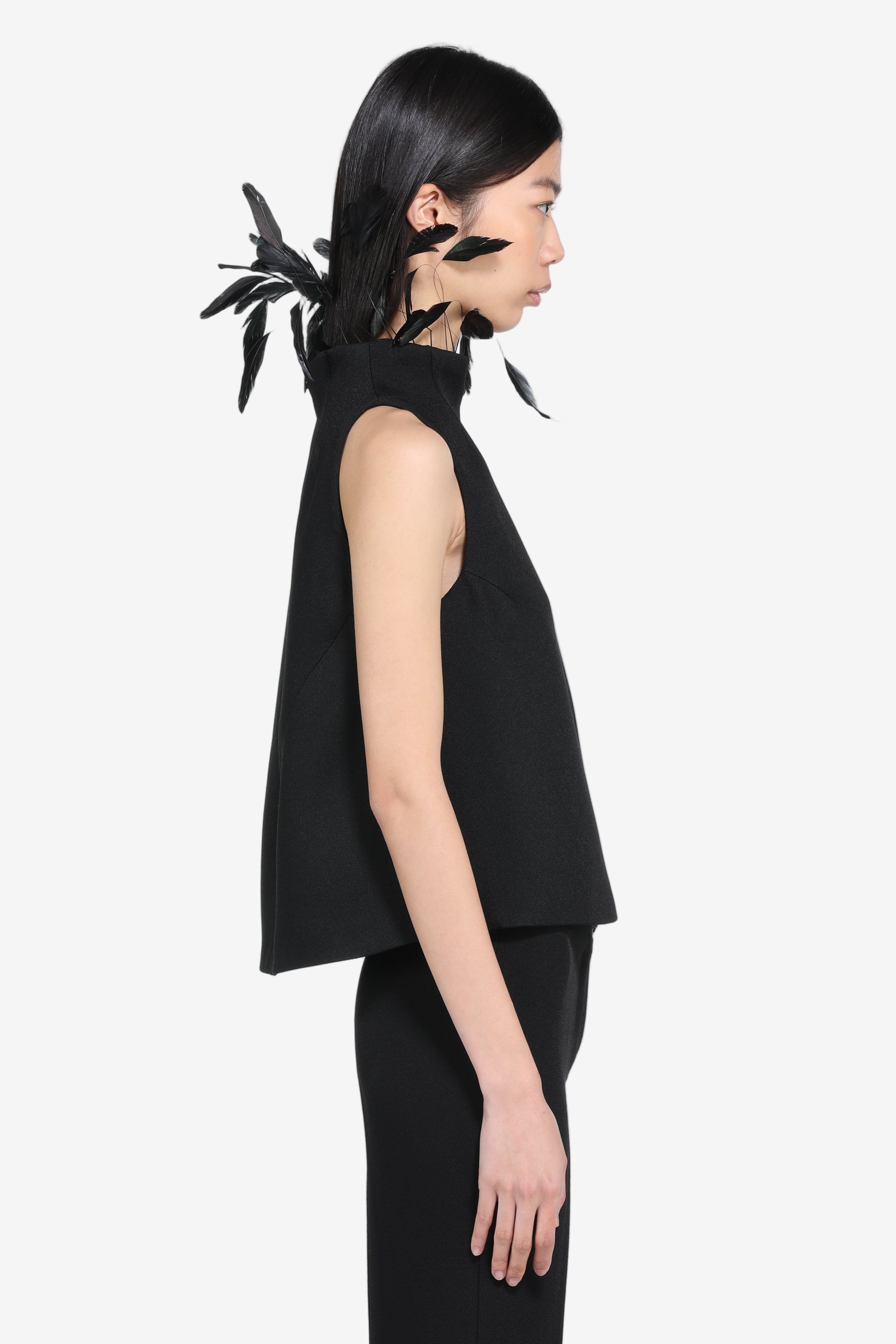 Sleeveless top with feathers