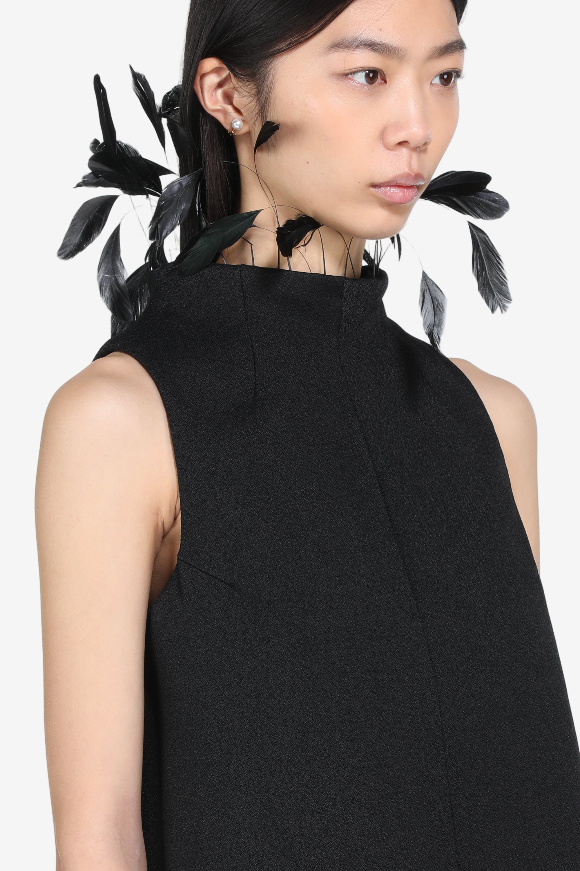 Sleeveless top with feathers