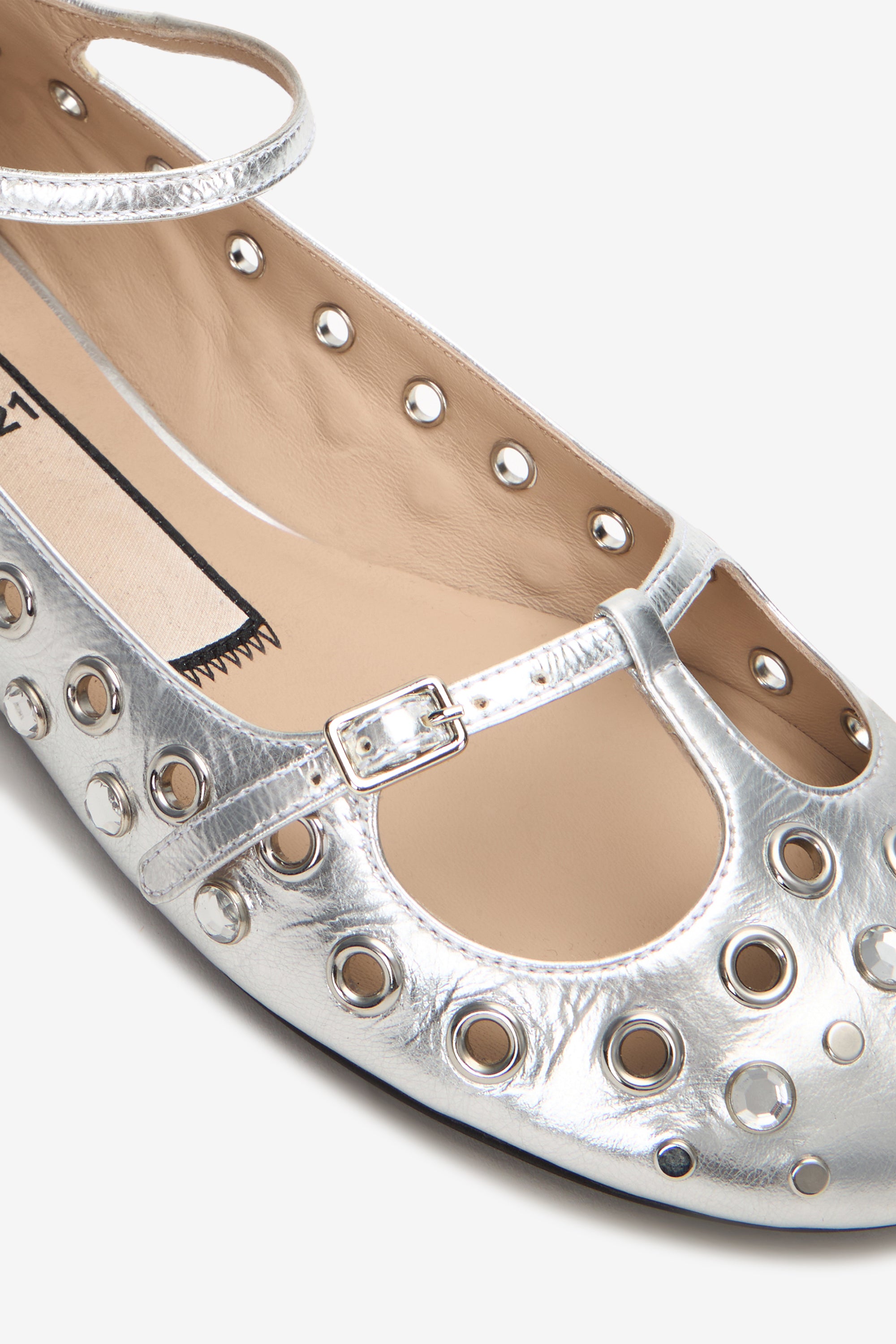 Ballerine punta tonda in pelle laminata con borchie