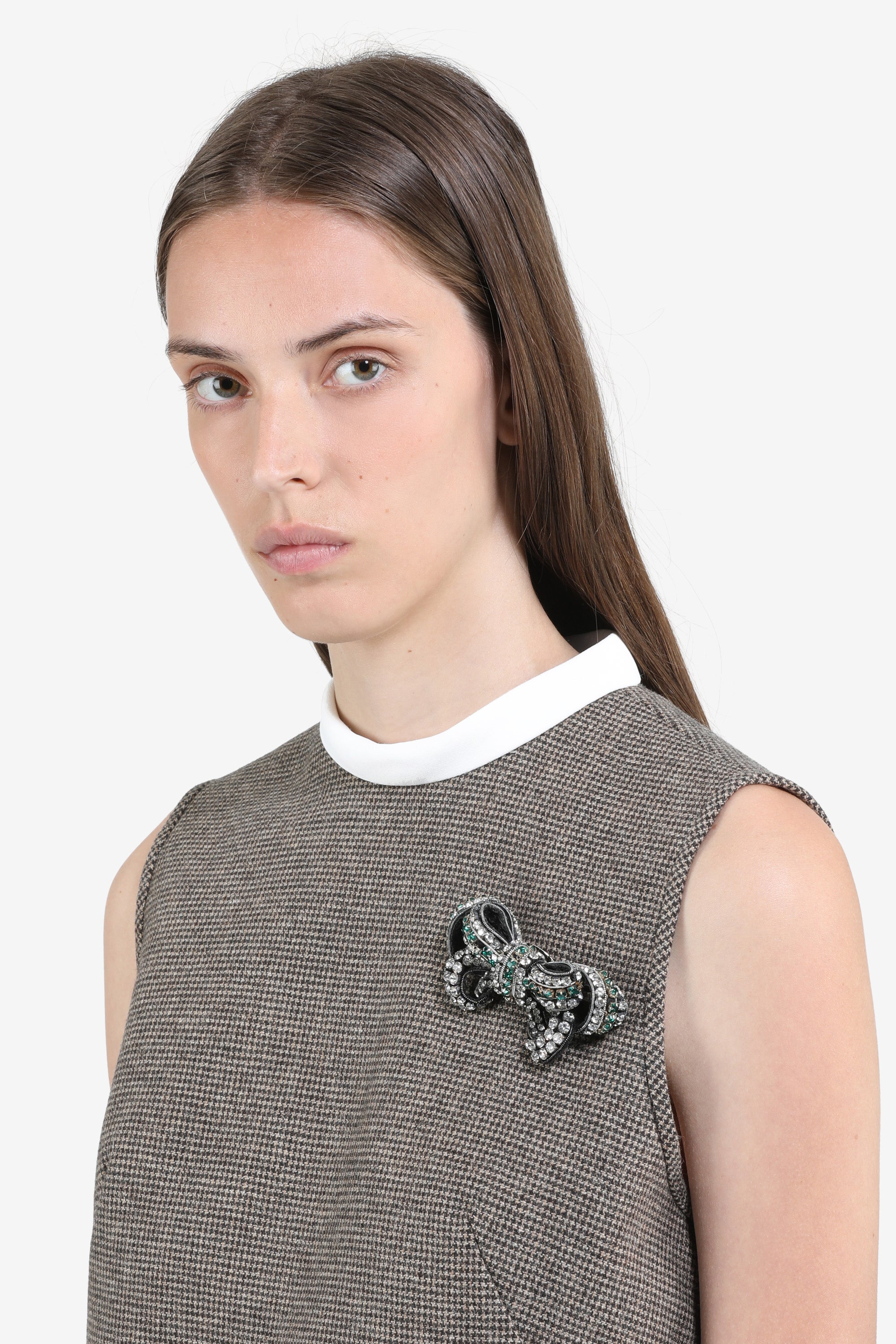 Metal and crystal bow brooch