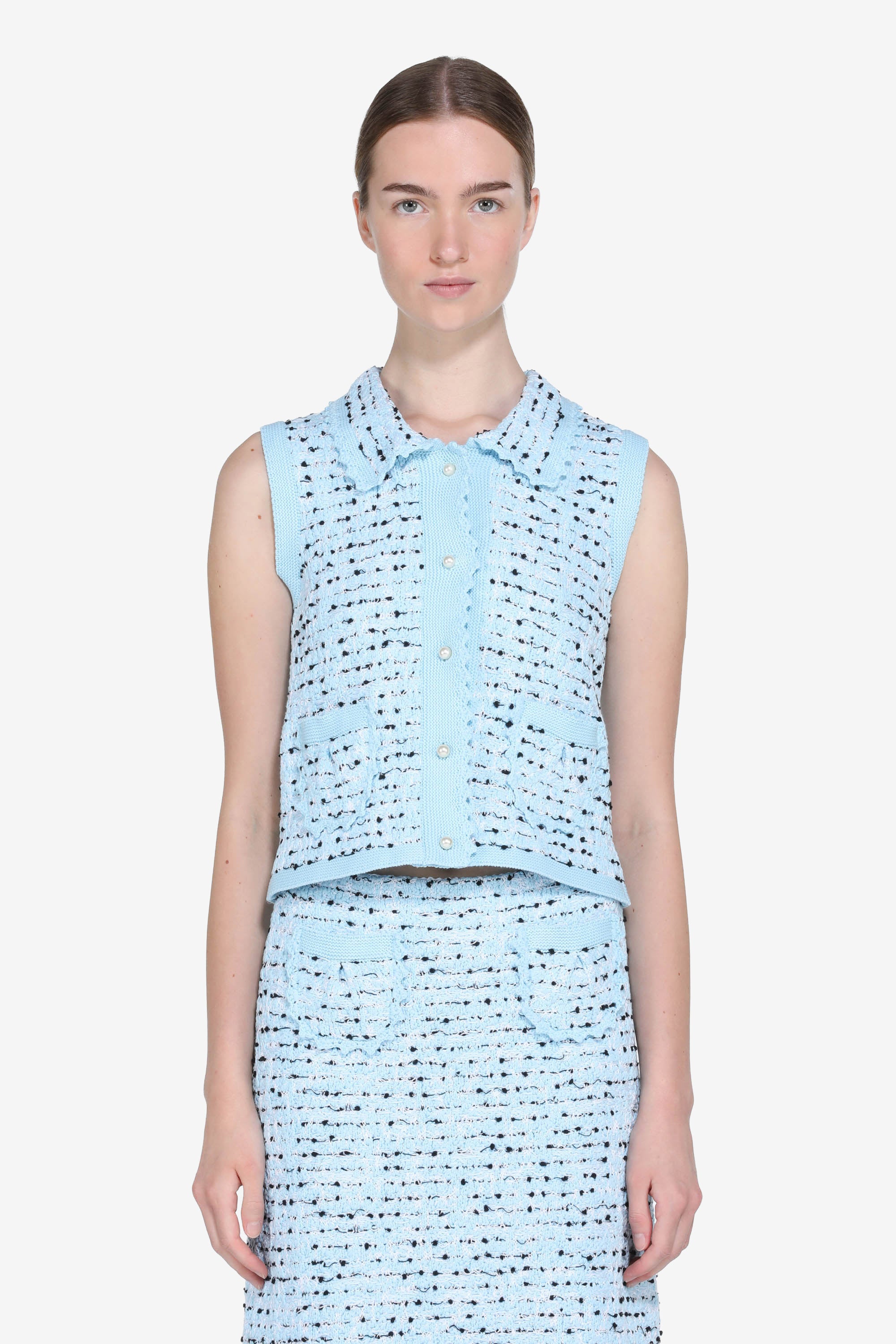 Knitted vest with pearl buttons