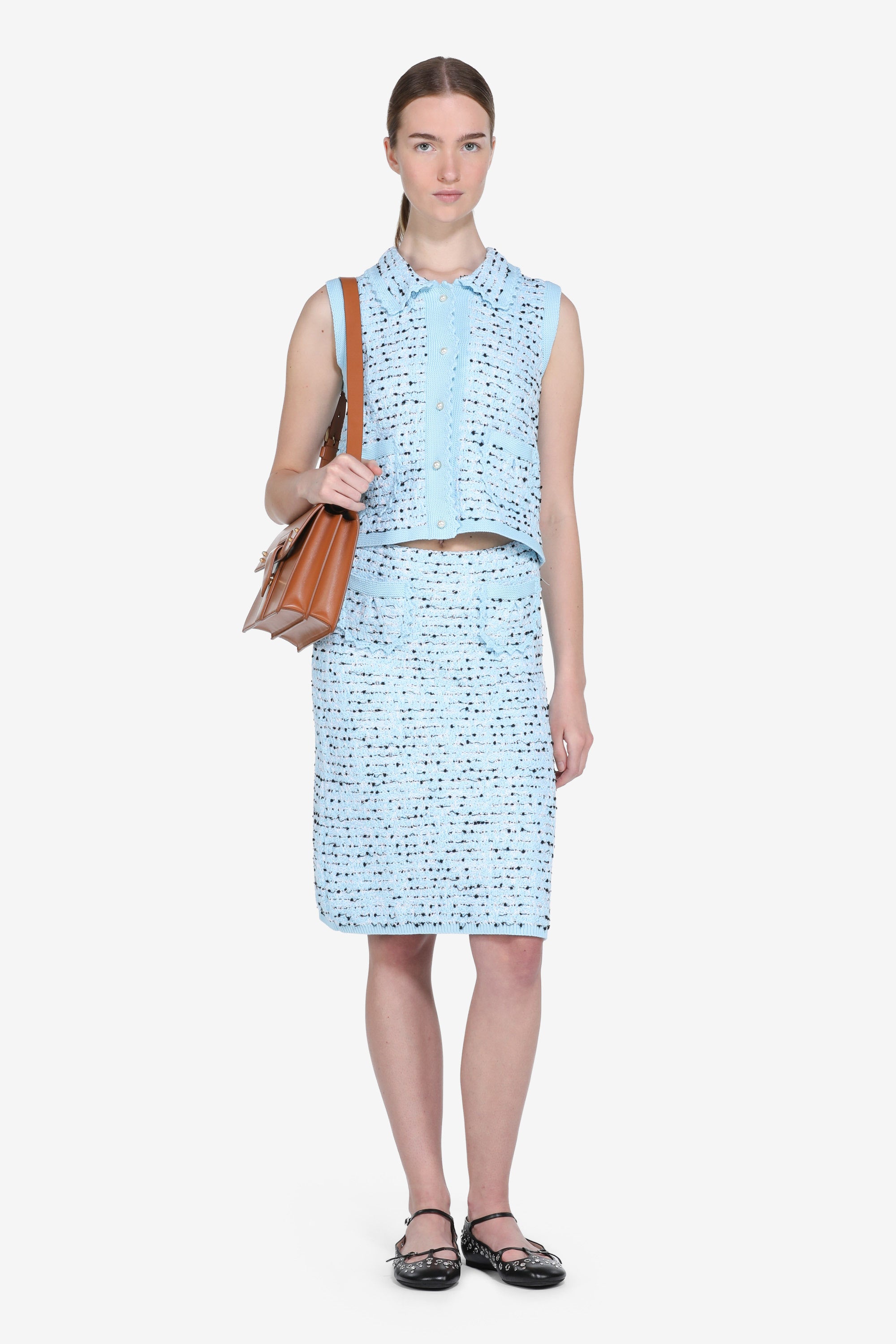 Knitted vest with pearl buttons