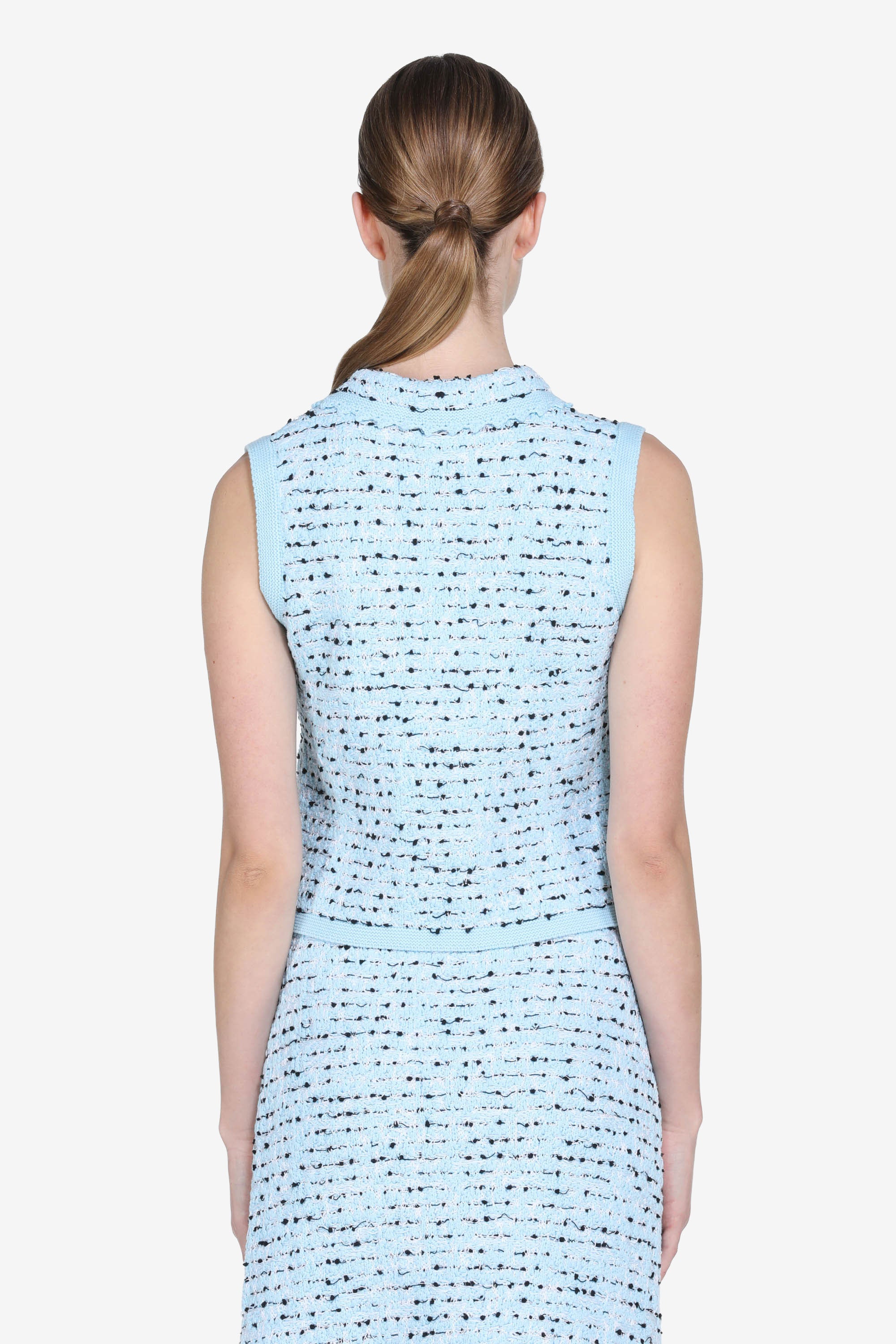 Knitted vest with pearl buttons