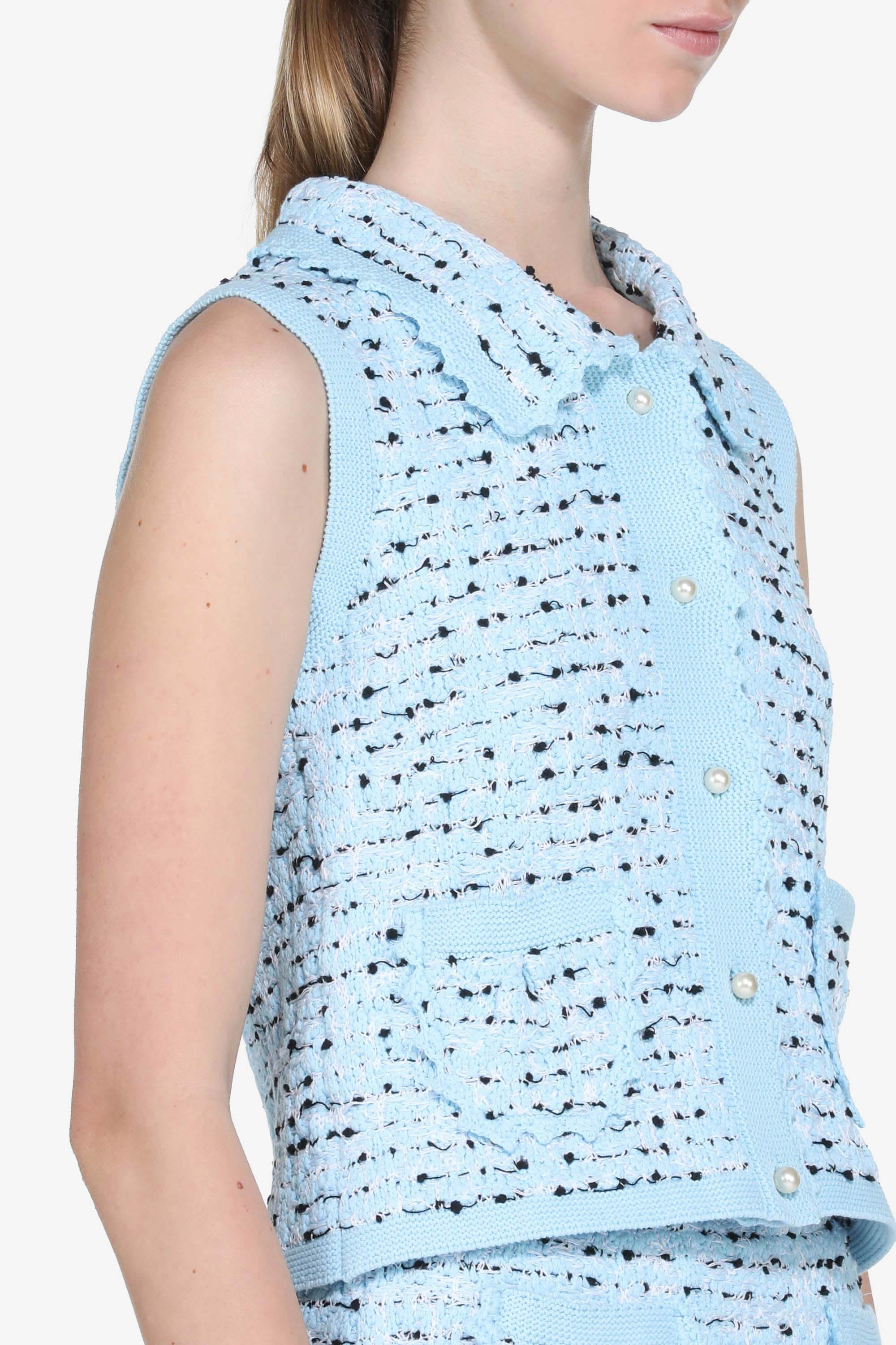 Knitted vest with pearl buttons